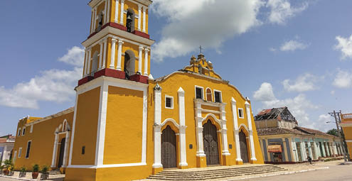 Yellow colonial style church of Iglesia Major in the city of Remedios, Cuba